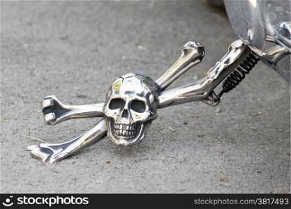 shiny prop-stand of motor bike, skull and bones prop-stand