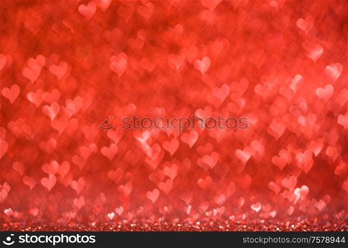 Shiny red heart love bokeh glitter lights abstract background, Valentine&rsquo;s day party celebration concept. Shiny red heart lights background