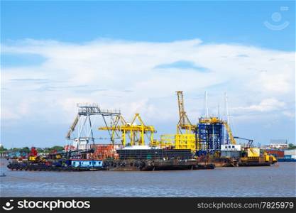 Ship and cargo port. Along the river. The Water Transport Industry.
