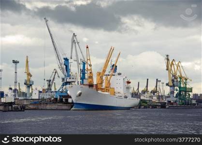Ship and cranes. Harbor activity. St. Petersburg. Russia.