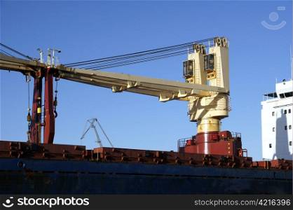 Ship cranes on a deck of the cargoship