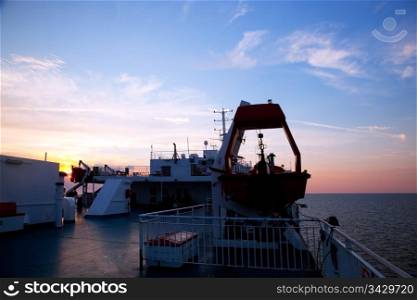 Ship deck, board view. Ocean, sea at sunset