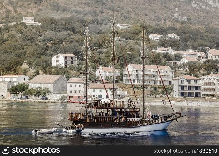 ship on the background of coastal architecture in Montenegro