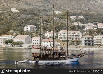 ship on the background of coastal architecture in Montenegro