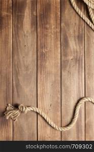 ship rope at wooden board background texture, top veiw