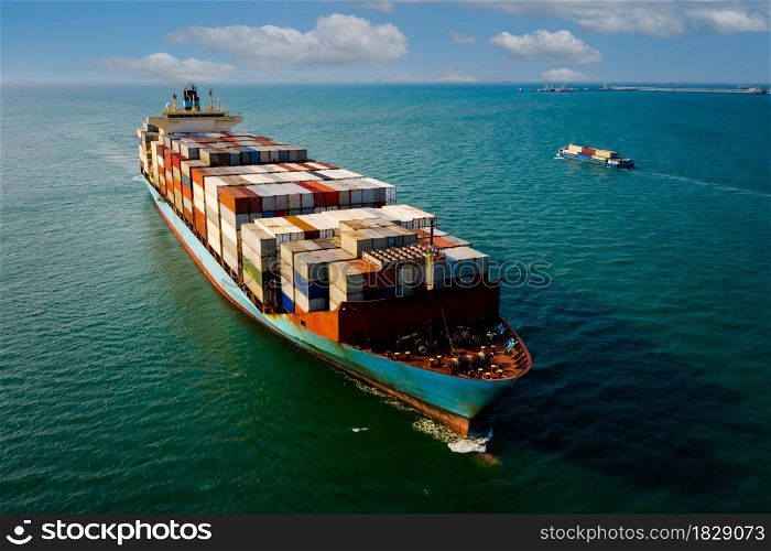 shipping cargo containers businesses services import and export international transportation open sea landscape aerial view blue sky background from drone