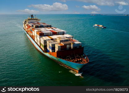 shipping cargo containers businesses services import and export international transportation open sea landscape aerial view blue sky background from drone