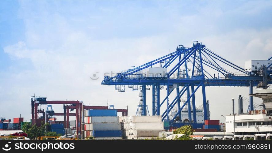 Shipping cargo crane and container ship in export car import business and logistics in harbor industry and water transport International