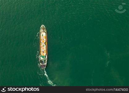 shipping oil and gas sailing on the green sea aerial top view
