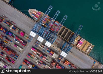 shipping port and container ship in export and import business and logistics. Shipping cargo to harbor by crane. Water transport International. Aerial view