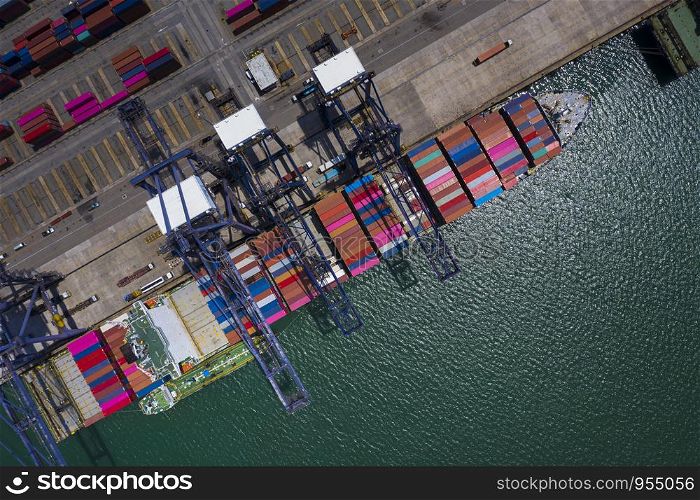 shipping port loading and unloading cargo containers logistics service station international shipping business by the sea vessel aerial view