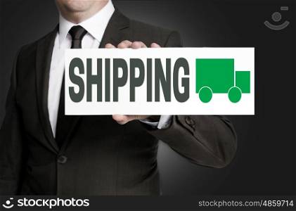 shipping sign is held by businessman background. shipping sign is held by businessman background.