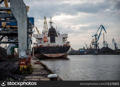Ships and cranes at a port terminal.