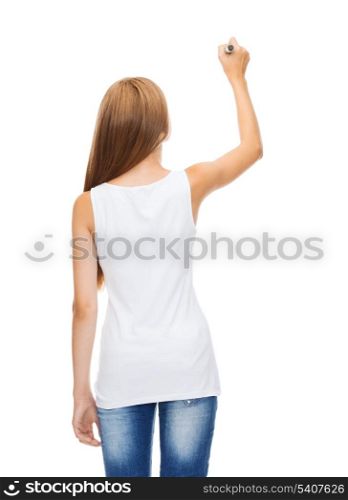 shirt design and advertisement concept - teenage girl in blank white shirt from the back drawing or writing something in the air