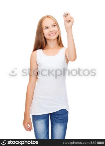 shirt design concept - smiling teenage girl in blank white shirt drawing or writing something in the air