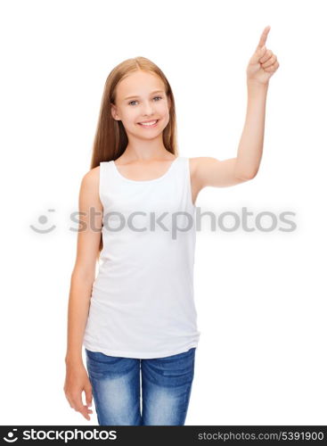 shirt design concept - smiling teenage girl in blank white shirt pointing to something or pressing imaginary button