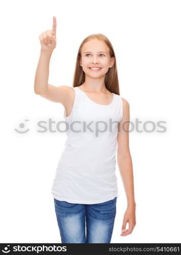 shirt design concept - smiling teenage girl in blank white shirt pointing to something or pressing imaginary button