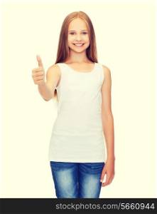 shirt design concept - smiling teenage girl in blank white shirt showing thumbs up