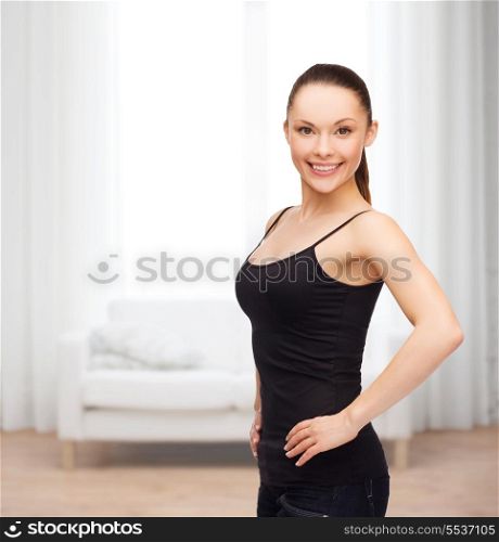shirt design concept - smiling woman in blank black shirt