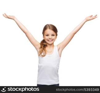 shirt design, happiness, freedom, future concept - smiling teenage girl in blank white shirt with raised hands