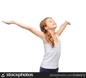 shirt design, happiness, freedom, future concept - smiling teenage girl in blank white shirt with raised hands and closed eyes