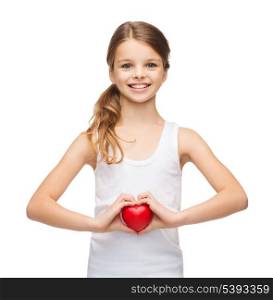 shirt design, health, charity, love concept - smiling teenage girl in blank white shirt with small red heart