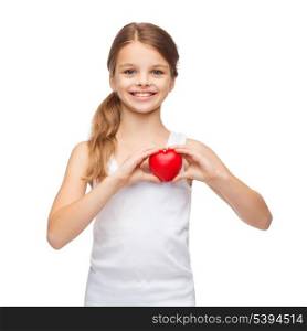 shirt design, health, charity, love concept - smiling teenage girl in blank white shirt with small red heart