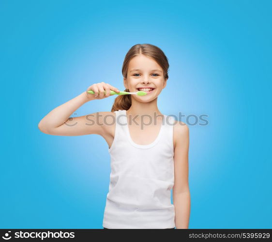 shirt design, health, oral hygiene, dental concept - smiling teenage girl in blank white shirt brushing her teeth