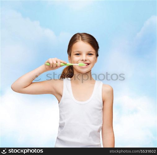 shirt design, health, oral hygiene, dental concept - smiling teenage girl in blank white shirt brushing her teeth