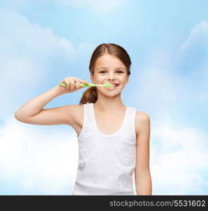 shirt design, health, oral hygiene, dental concept - smiling teenage girl in blank white shirt brushing her teeth