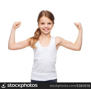 shirt design, stamina, strength, health, sport, fitness concept - smiling teenage girl in blank white shirt showing muscles