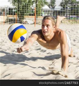shirtless man playing volleyball beach