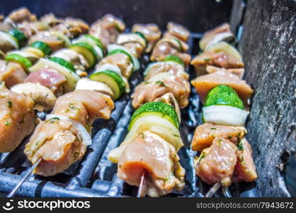 shish kebab on skewers on a grill on a holiday