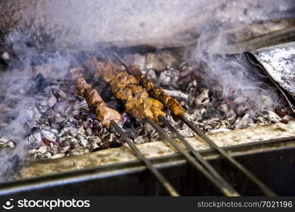 Shish kebab roasting on the barbacue. traditional kusleme kebap.Cooking meat on fire.