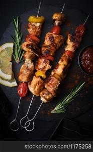 Shish kebab with mushrooms, cherry tomato and sweet pepper, Grilled meat skewers.