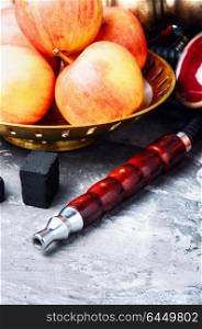 Shisha hookah with apple. Smoke hookah with red apple.Shisha concept.Hookah concept