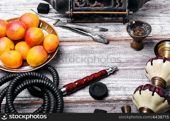 Shisha with fruity aroma. Details Eastern smoking hookah with fruit apricot