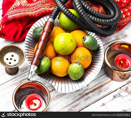 Shisha with taste of lime and tangerines. hookah in Arabic style with a taste of lime and tangerines
