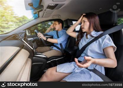 shocked and scared young couple while driving a car