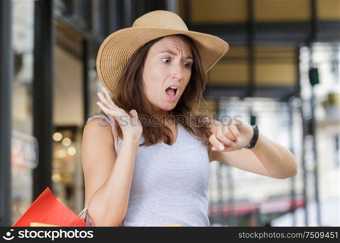 shocked beautiful woman in shopping while being at work