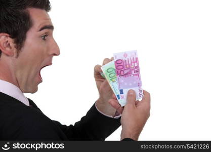 Shocked businessman counting his Euros