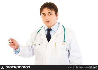 Shocked doctor holding medical thermometer in hand isolated on white&#xA;