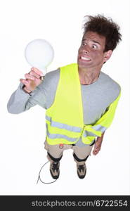 Shocked man holding light-bulb