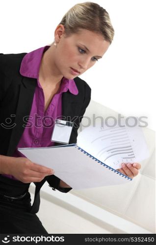 Shocked woman reading document