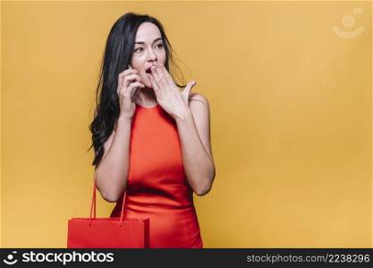 shocked woman speaking phone while shopping