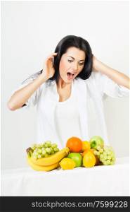 shocked woman with fruits
