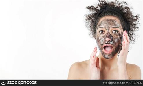 shocked young woman with black face mask her face isolated white background