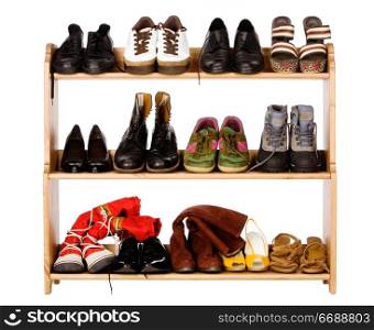 Shoes, gym shoes, boots and other footwear stand on a rackShoes, gym shoes, boots and other footwear stand on a rack