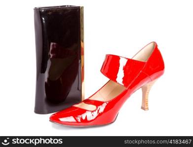 Shoes on a high heel and new elegant varnished leather handbag