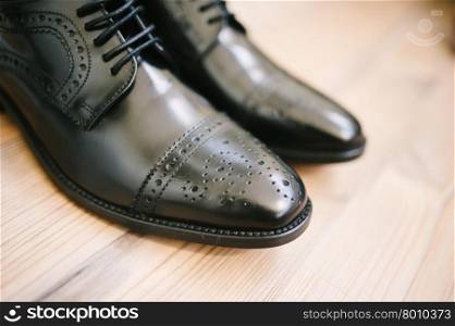 Shoes. Pair of formal man shoes. Expensive custom made shoes. Wedding detail.